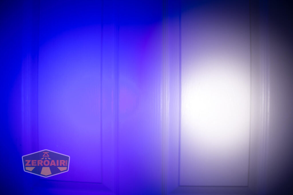 Armytek Wizard C2 WUV Headlamp beamshot on door compared to nichia 219b