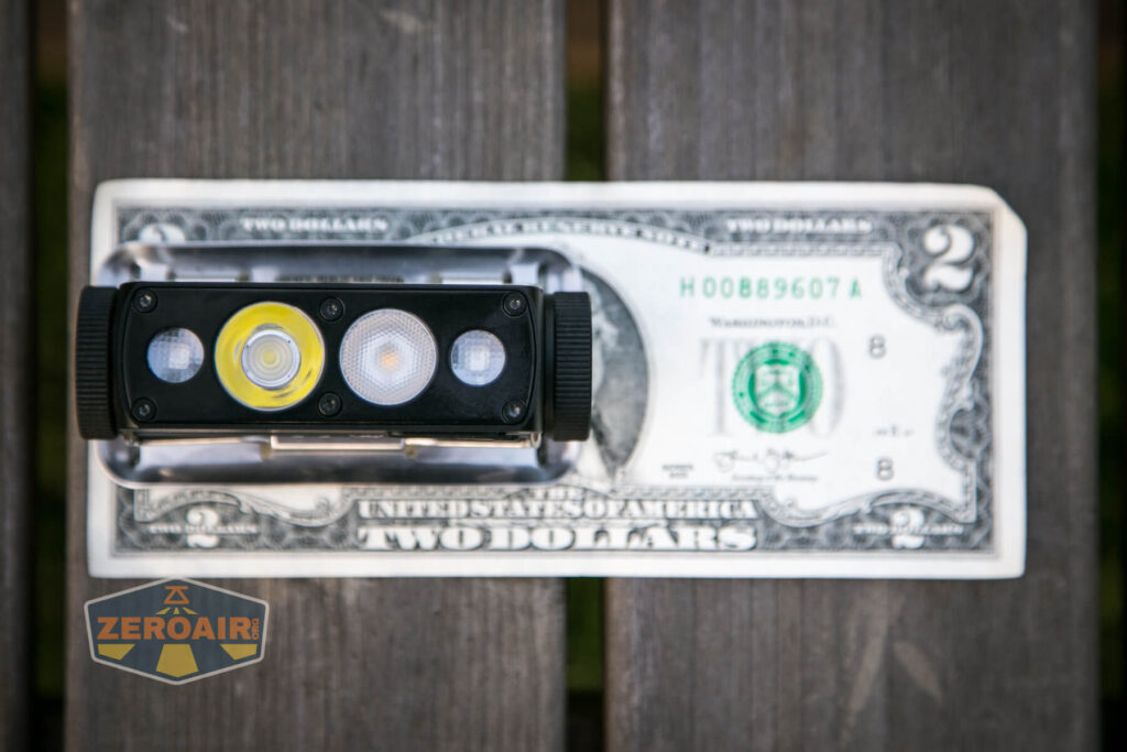 Cyansky HS6R headlamp on two-dollar bill