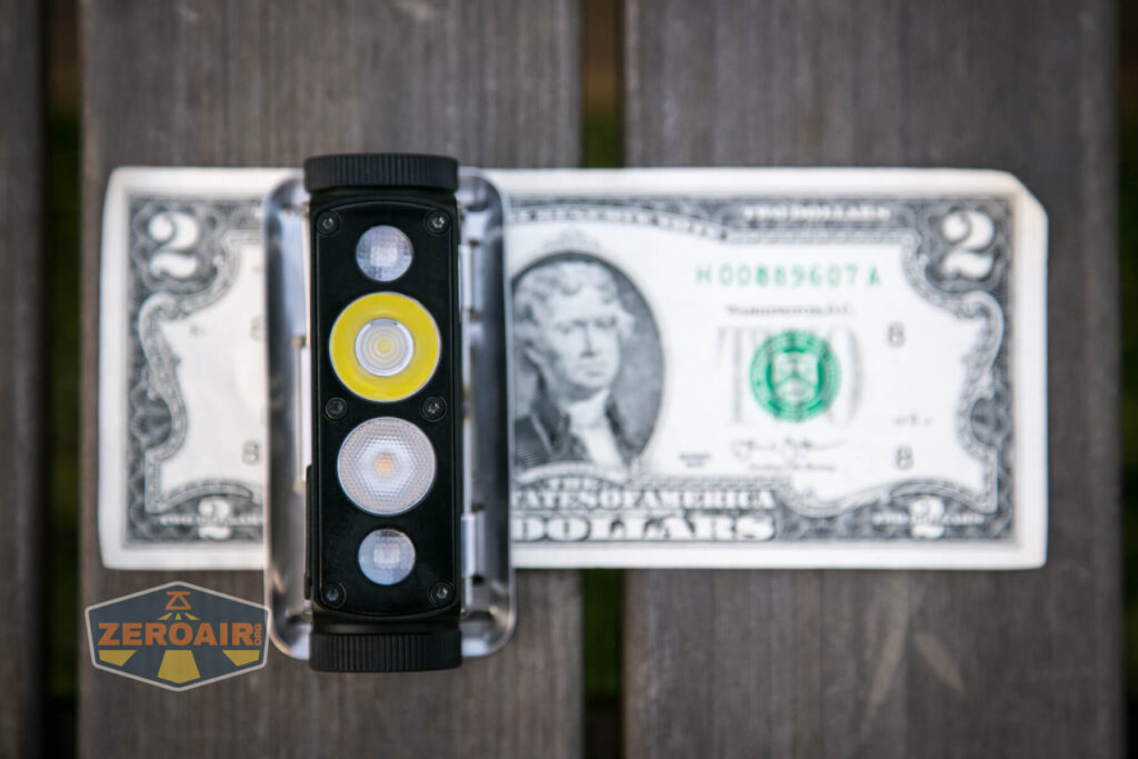 Cyansky HS6R headlamp on two-dollar bill