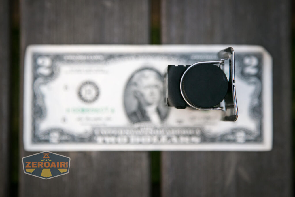 Cyansky HS6R headlamp on two-dollar bill