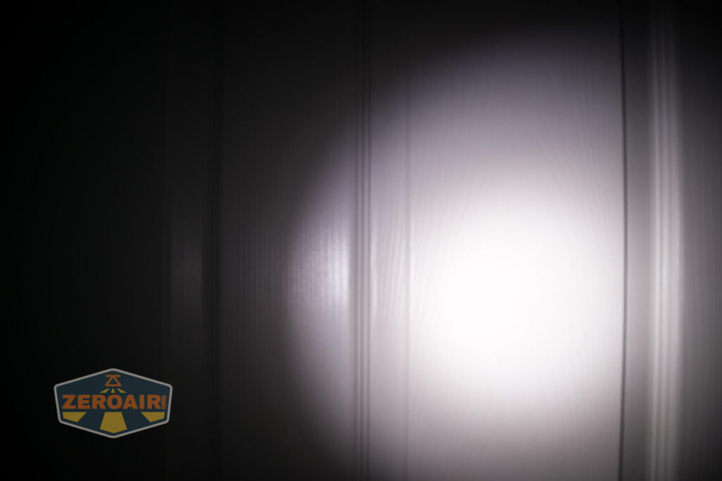 Olight X9R Cell door beamshot compared to nichia 219b