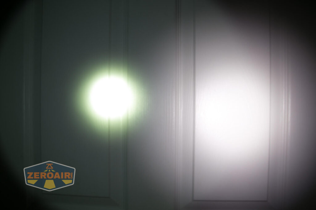 A white door with two circular spots of light shining on it, one bright and small on the left, and a larger, dimmer spot on the right. A ZeroAir logo appears in the bottom left corner.