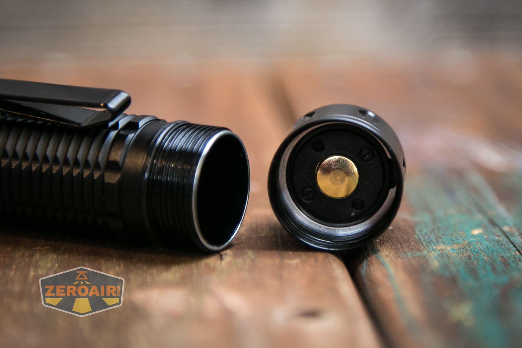Olight Warrior 3 flashlight tailcap button