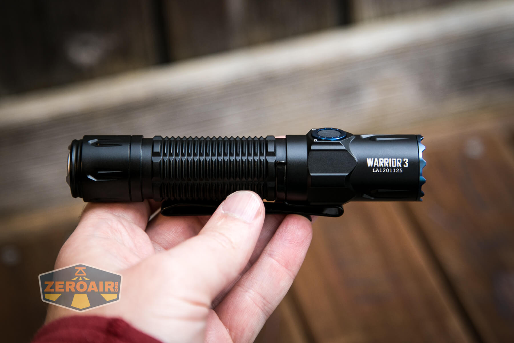 Olight Warrior 3 flashlight in hand