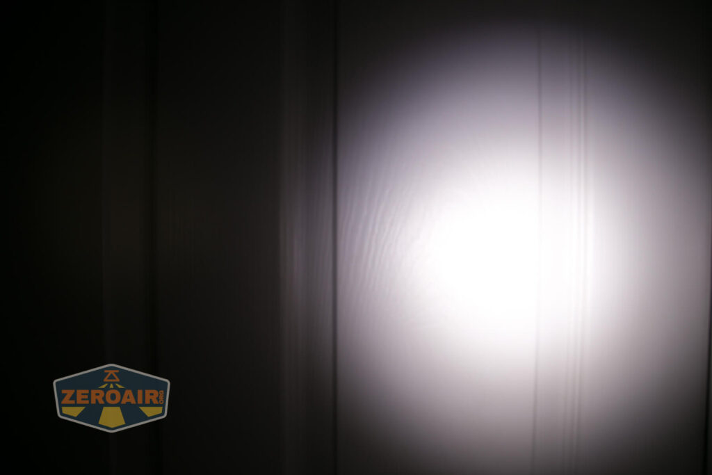Wurkkos TS21 Andúril Flashlight beamshots on door, compared to nichia 219b