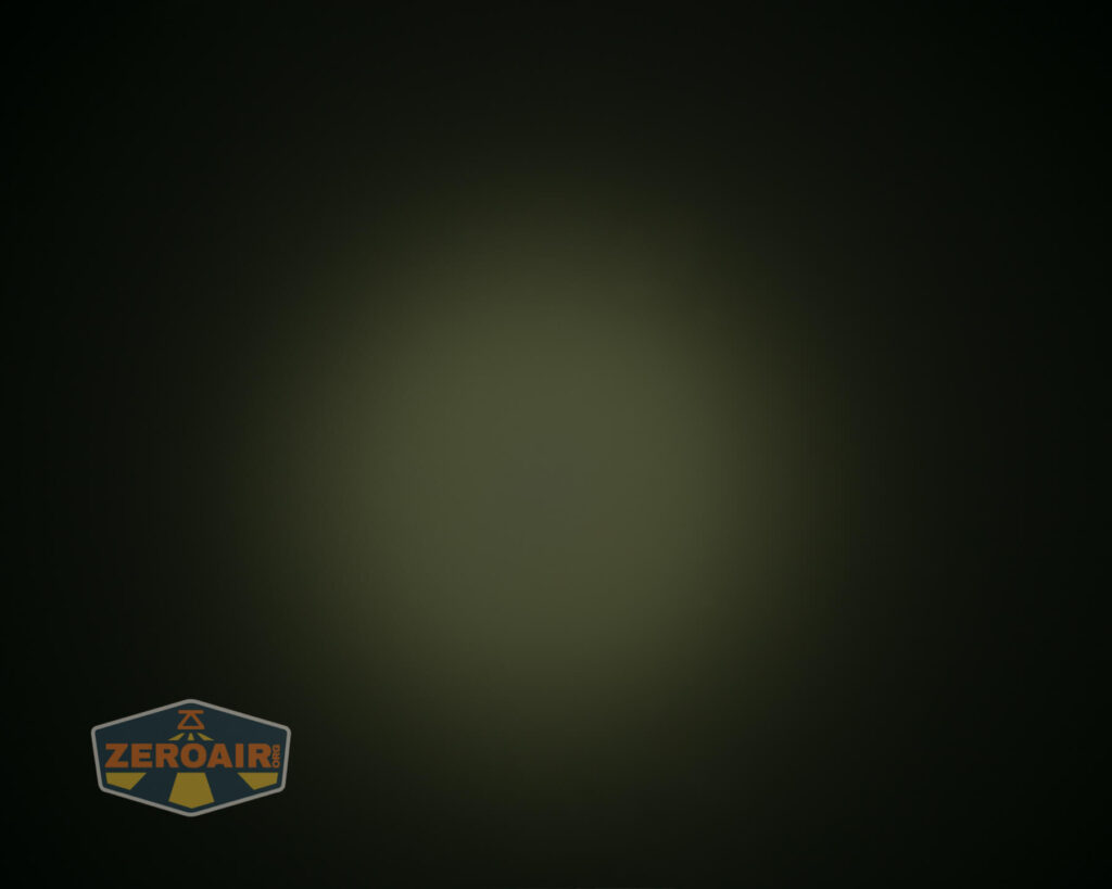 A circular, dim patch of greenish light appears in the center of a dark background. The ZeroAir logo is visible in the bottom left corner.