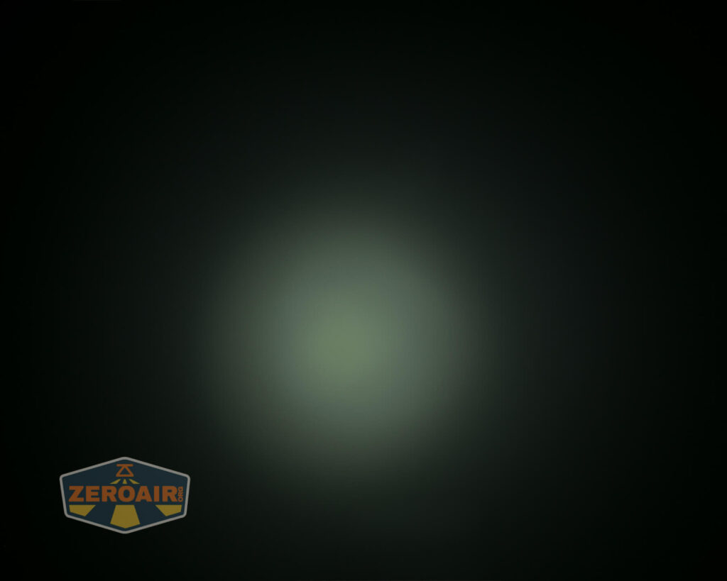 A dim, circular area of light is visible against a dark background. The ZeroAir logo appears in the bottom left corner of the image.