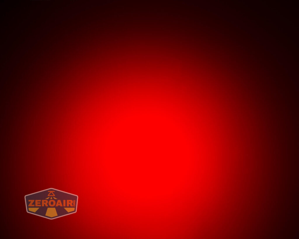 A bright red circular light source in the center fades to black at the edges. The ZeroAir logo appears in the bottom left corner.