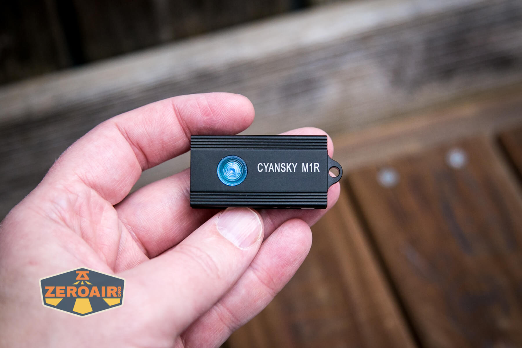 Cyansky M1R keychain flashlight in hand