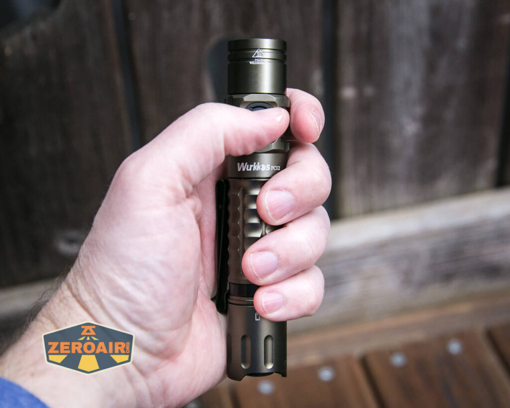 Wurkkos FC12 tactical flashlight in hand