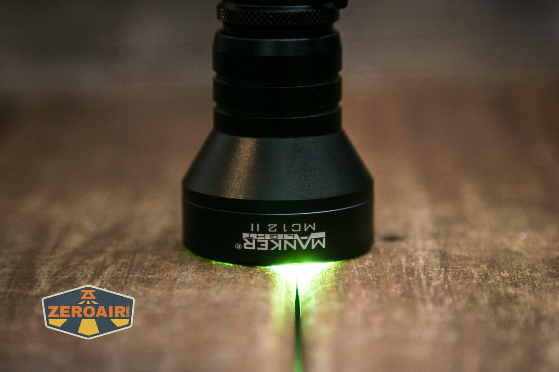 Manker MC12 II Tactical Flashlight headstanding and on