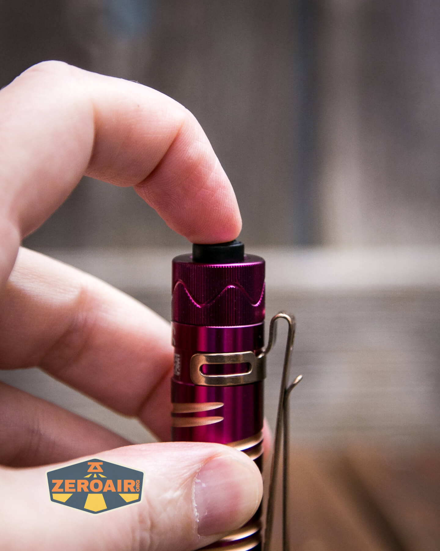 Olight i5R EOS Plum flashlight tailcap switch actuation