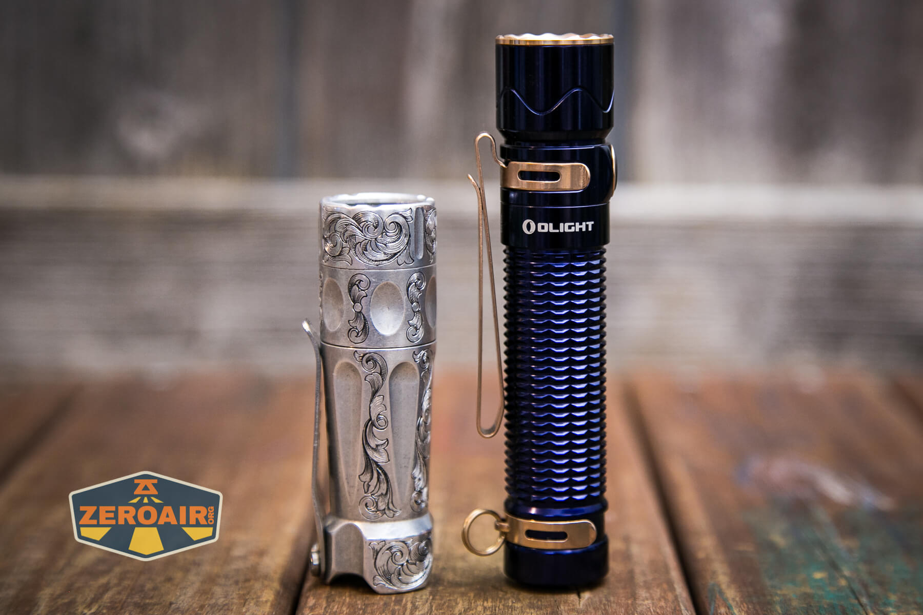 Olight Warrior Mini 2 Regal Blue beside torchlab boss 35