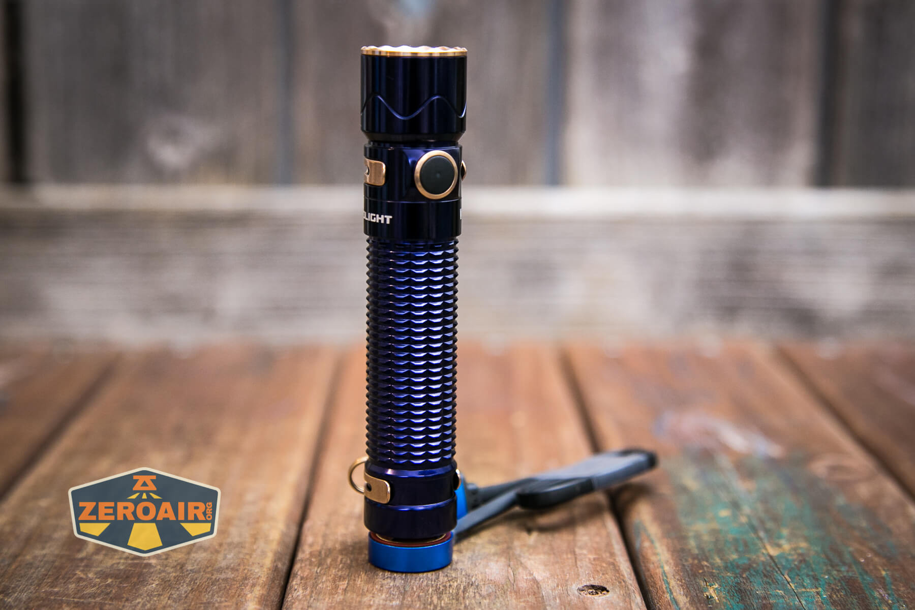 Olight Warrior Mini 2 Regal Blue on charging cable