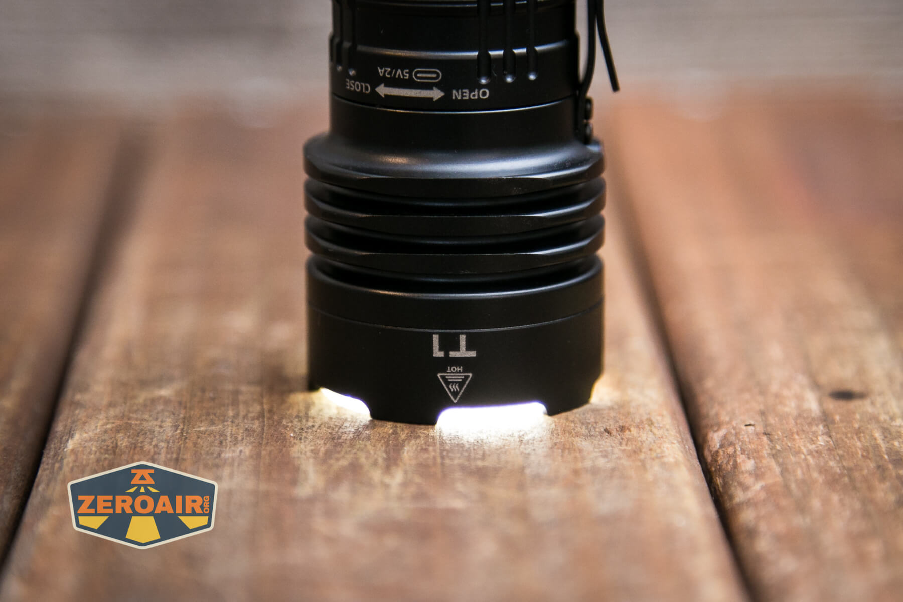 Wuben T1 Tactical flashlight emitter on headstanding