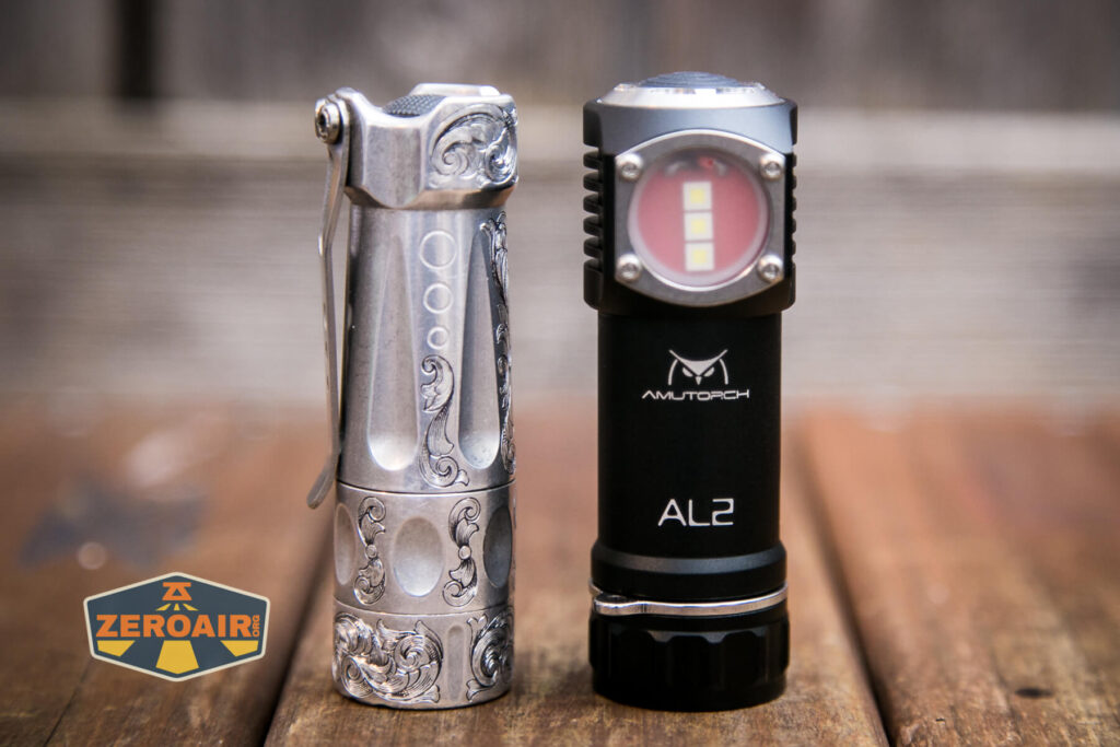 Amutorch AL2 flashlight beside the TorchLAB BOSS 35 (custom engraved) 