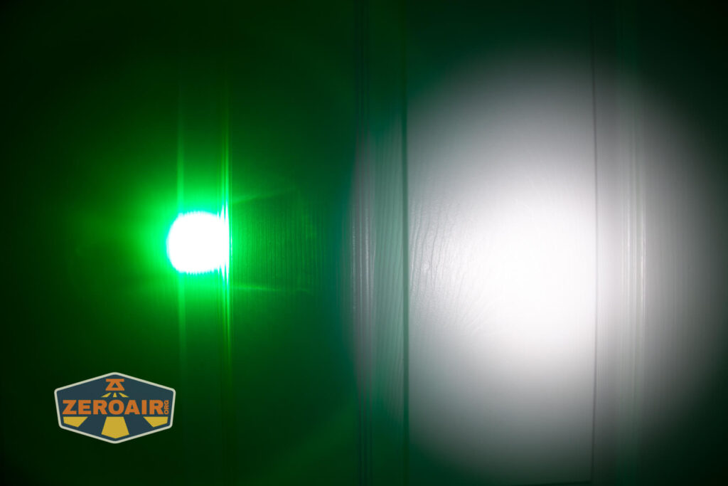 Brinyte HL28 Artemis headlamp beamshots on door compared to nichia 219b green zoomed