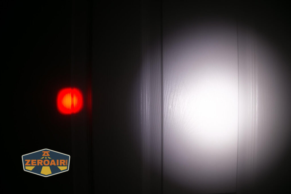 Brinyte HL28 Artemis headlamp beamshots on door compared to nichia 219b red zoomed