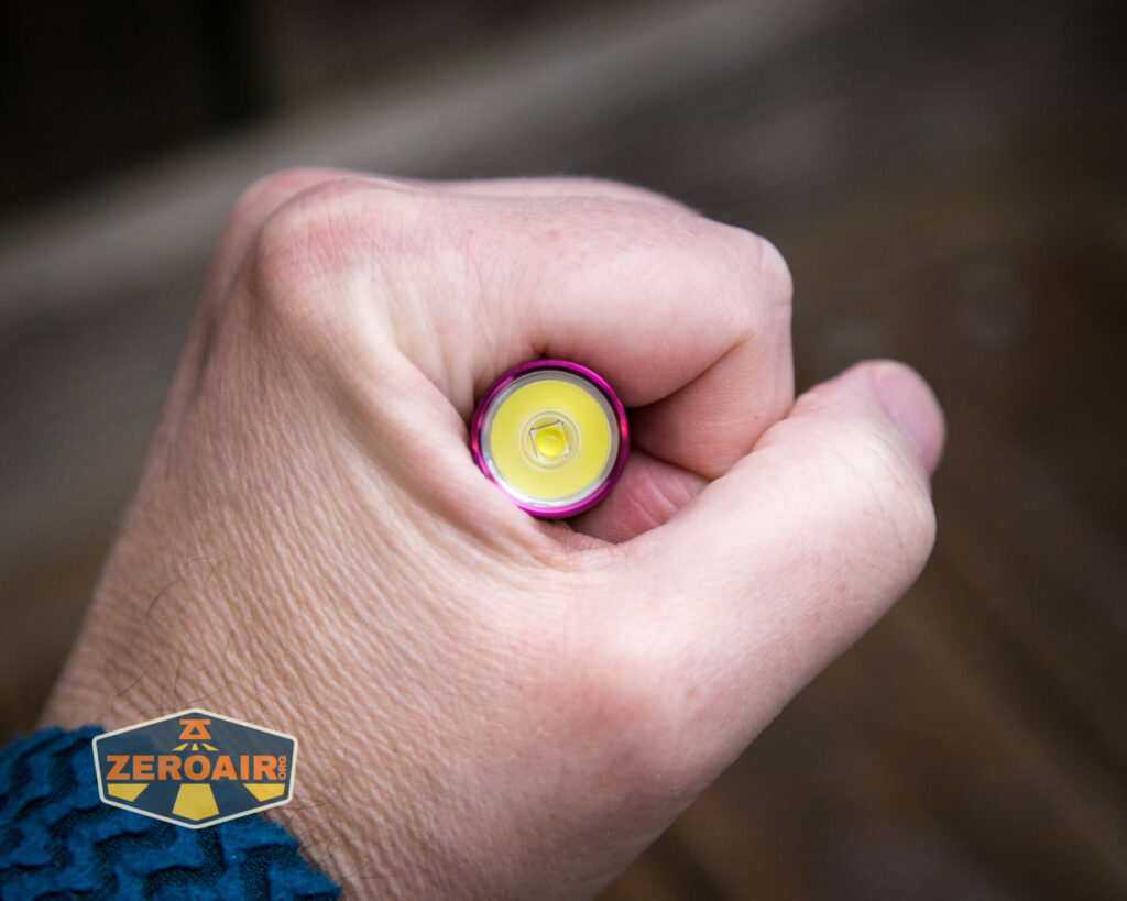 Olight i5R EOS Plum flashlight in hand