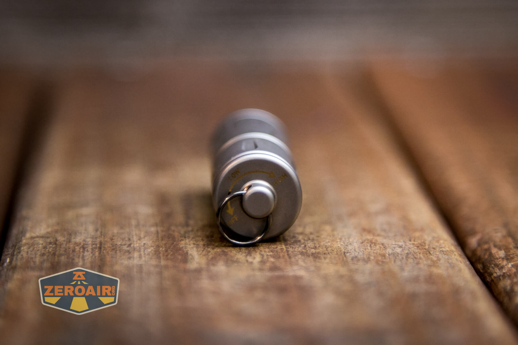 Olight iXV Ti keychain flashlight tail end