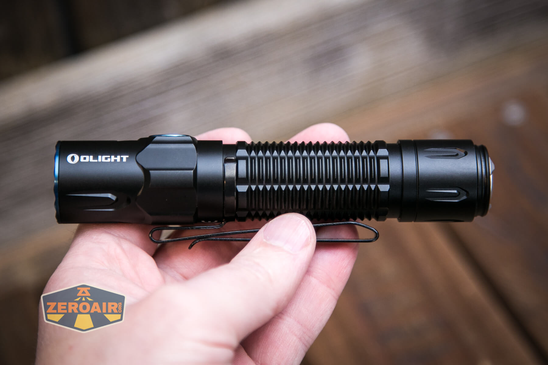 Olight warrior 3S flashlight in hand