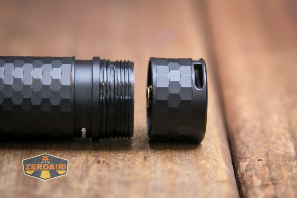 Brinyte E18 Pheme flashlight tailcap off showing threads