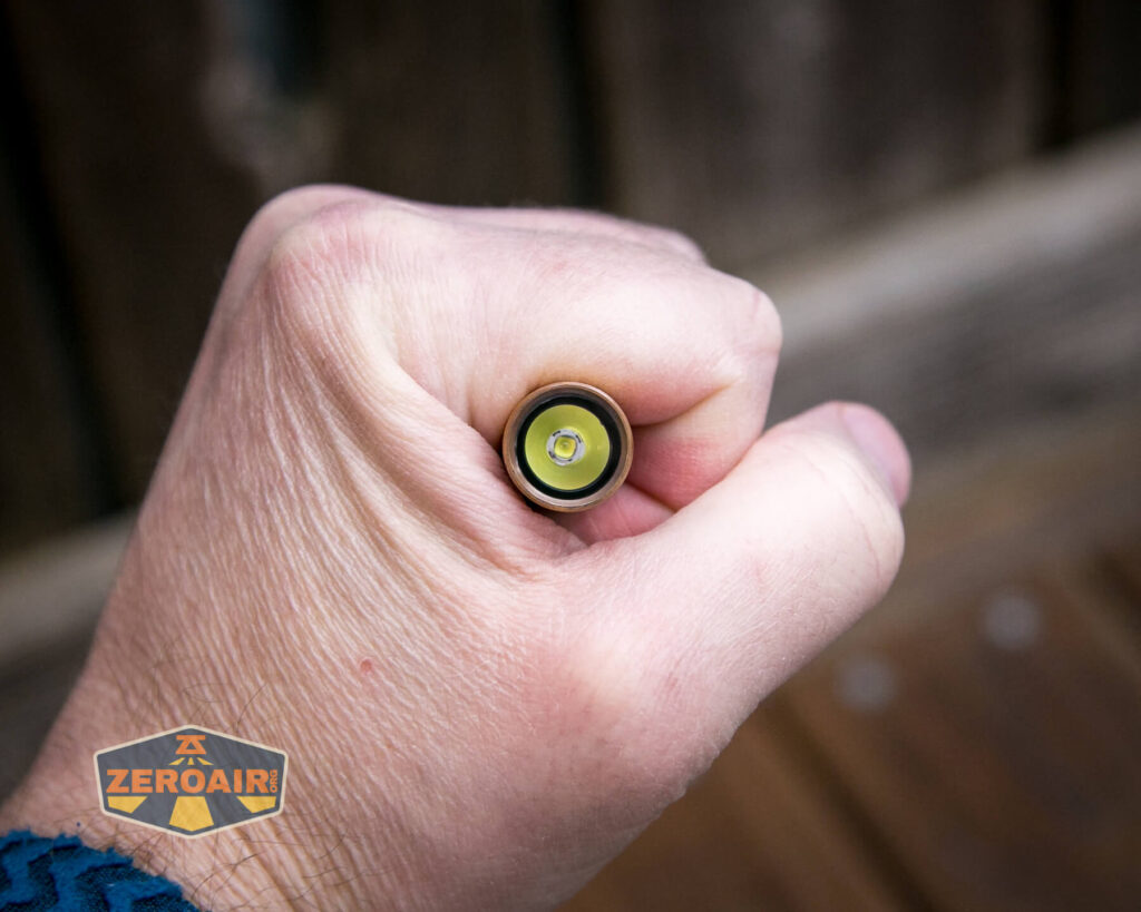 Olight i3T Plus Ancient Bamboo flashlight in hand