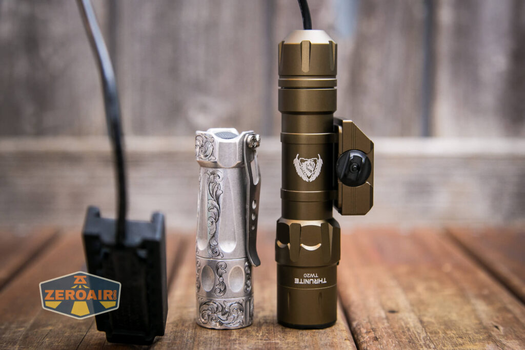 Thrunite TW20 flashlight beside torchlab boss 35
