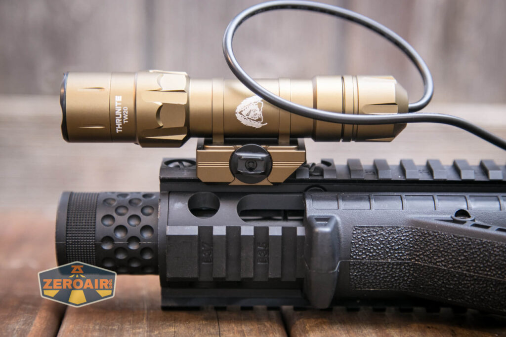 Thrunite TW20 flashlight mounted on rails
