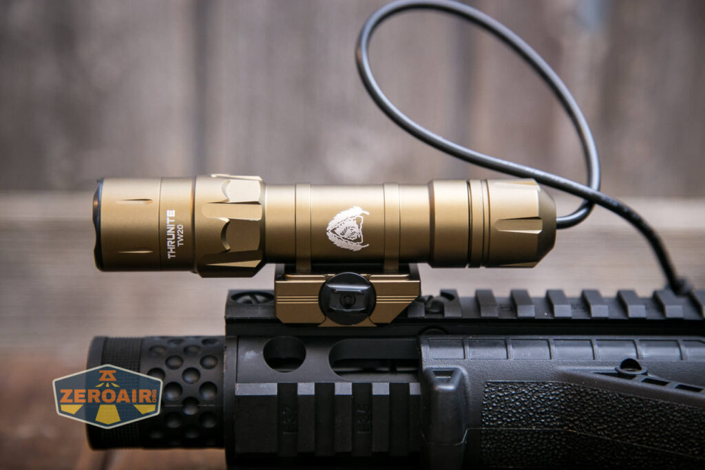 Thrunite TW20 flashlight mounted on rails