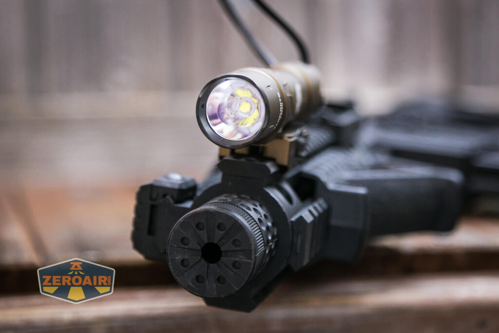 Thrunite TW20 flashlight mounted on rails