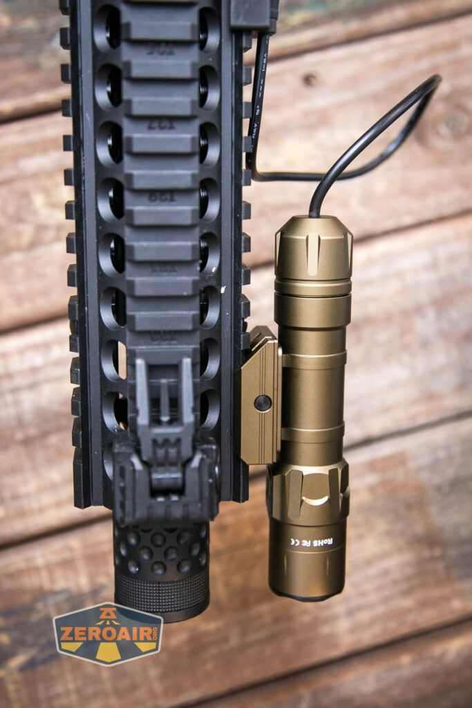 Thrunite TW20 flashlight mounted on rails