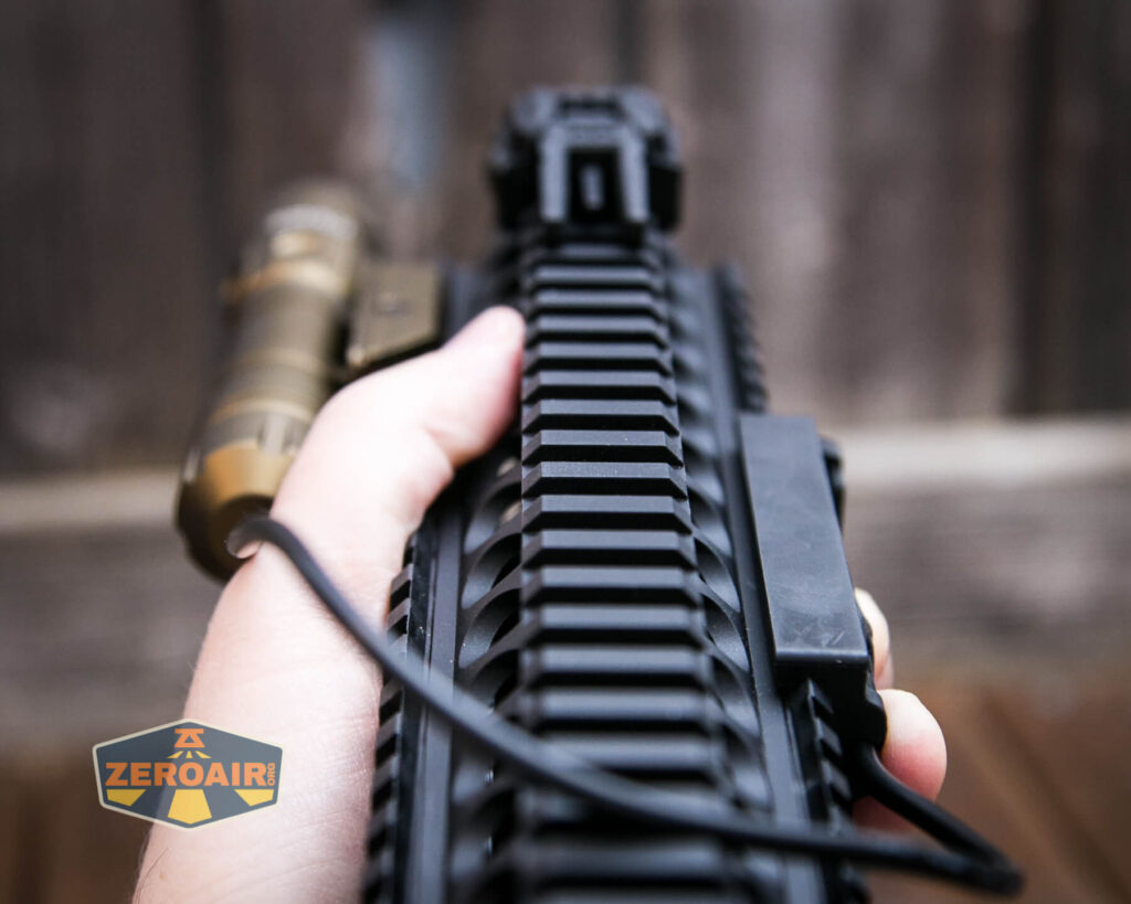 Thrunite TW20 flashlight mounted on rails