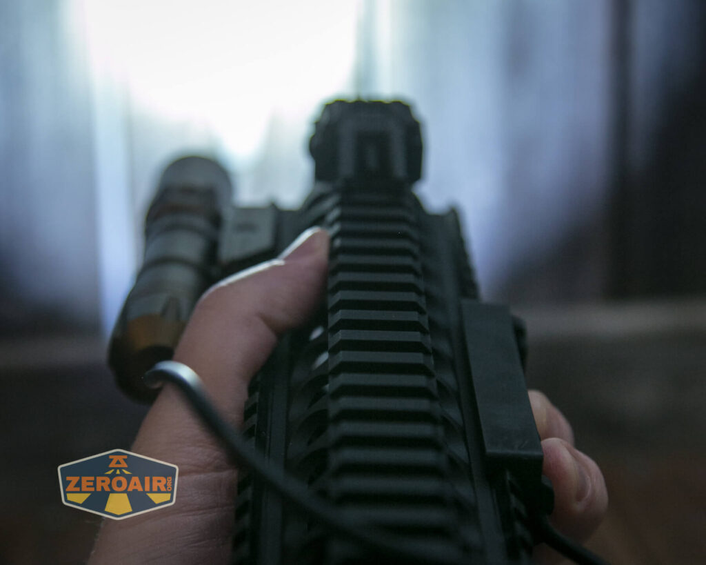 Thrunite TW20 flashlight mounted on rails