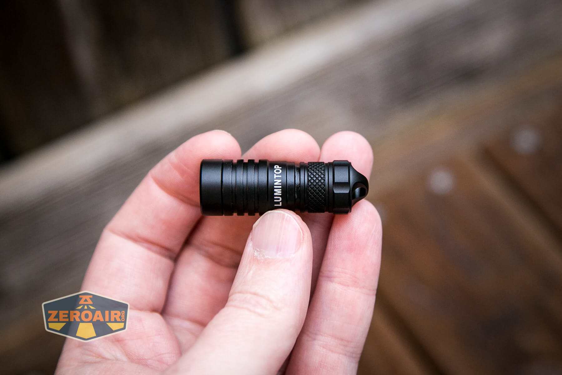 Lumintop Frog Keychain flashlight in hand
