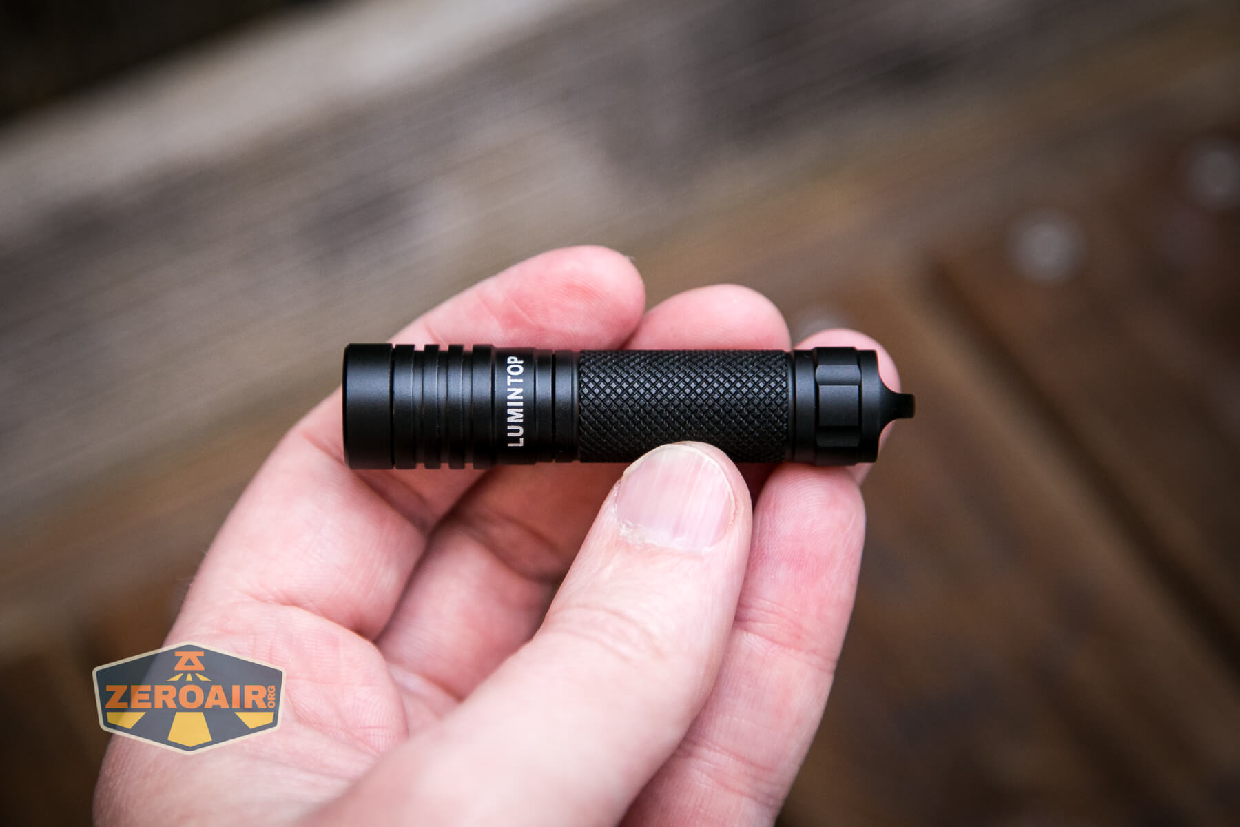 Lumintop Frog Keychain flashlight in hand