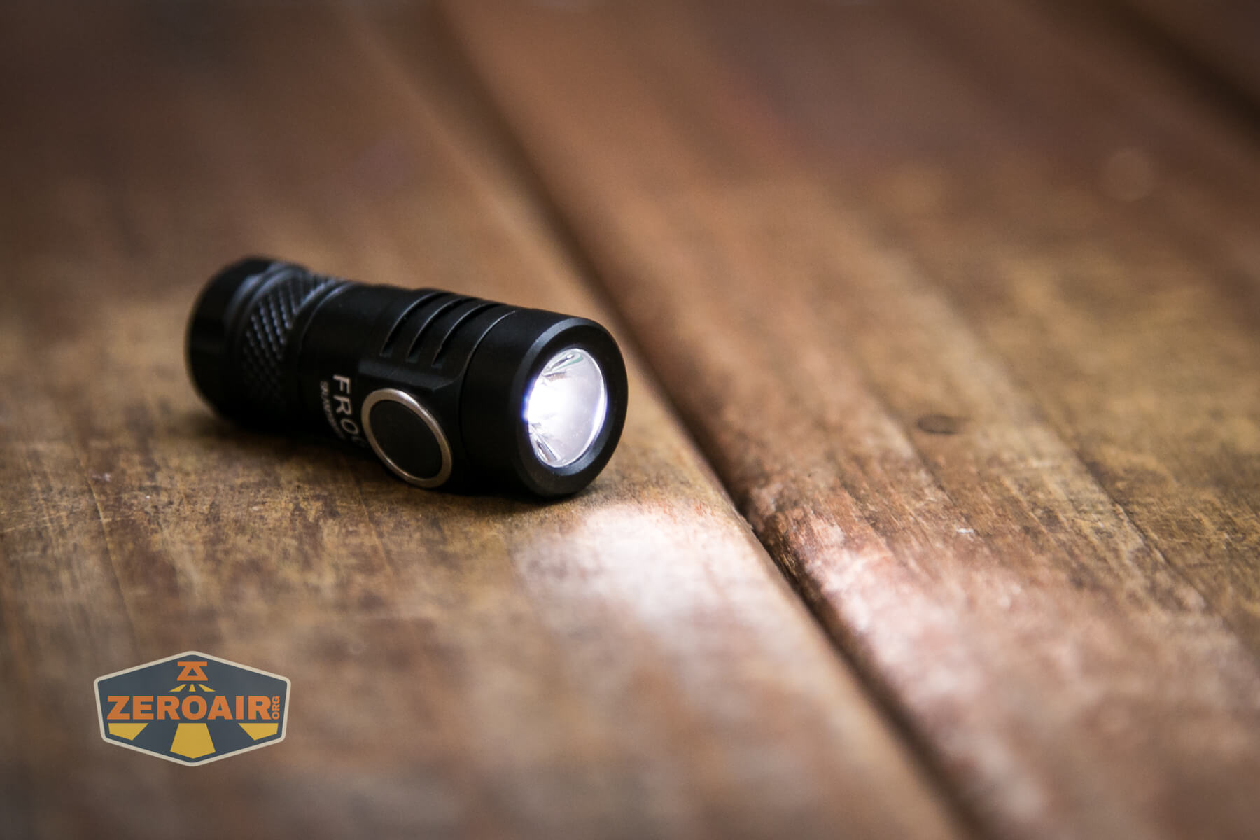 Lumintop Frog Keychain flashlight emitter on and TIR