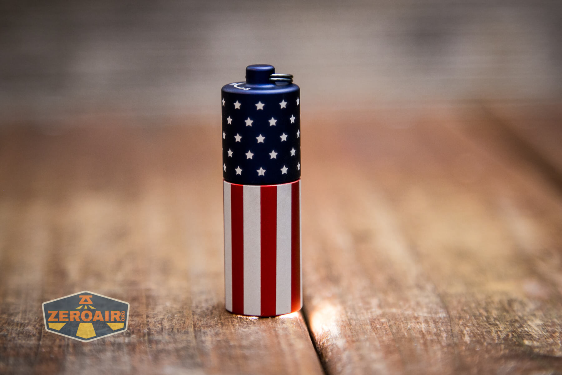 Olight i1R2 Pro Keychain Flashlight on and headstanding