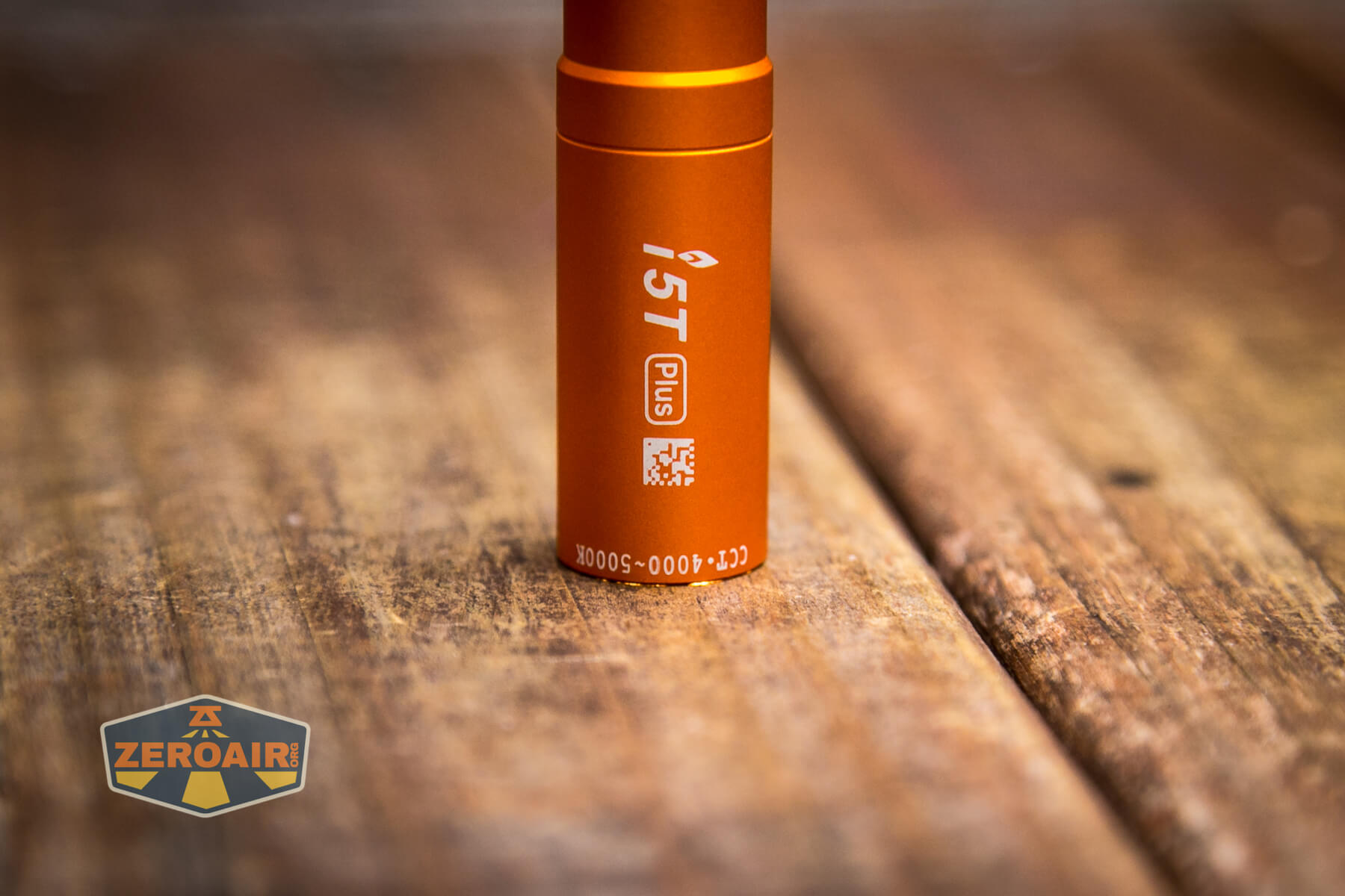 Olight i5T Plus Pebble flashlight smooth bezel