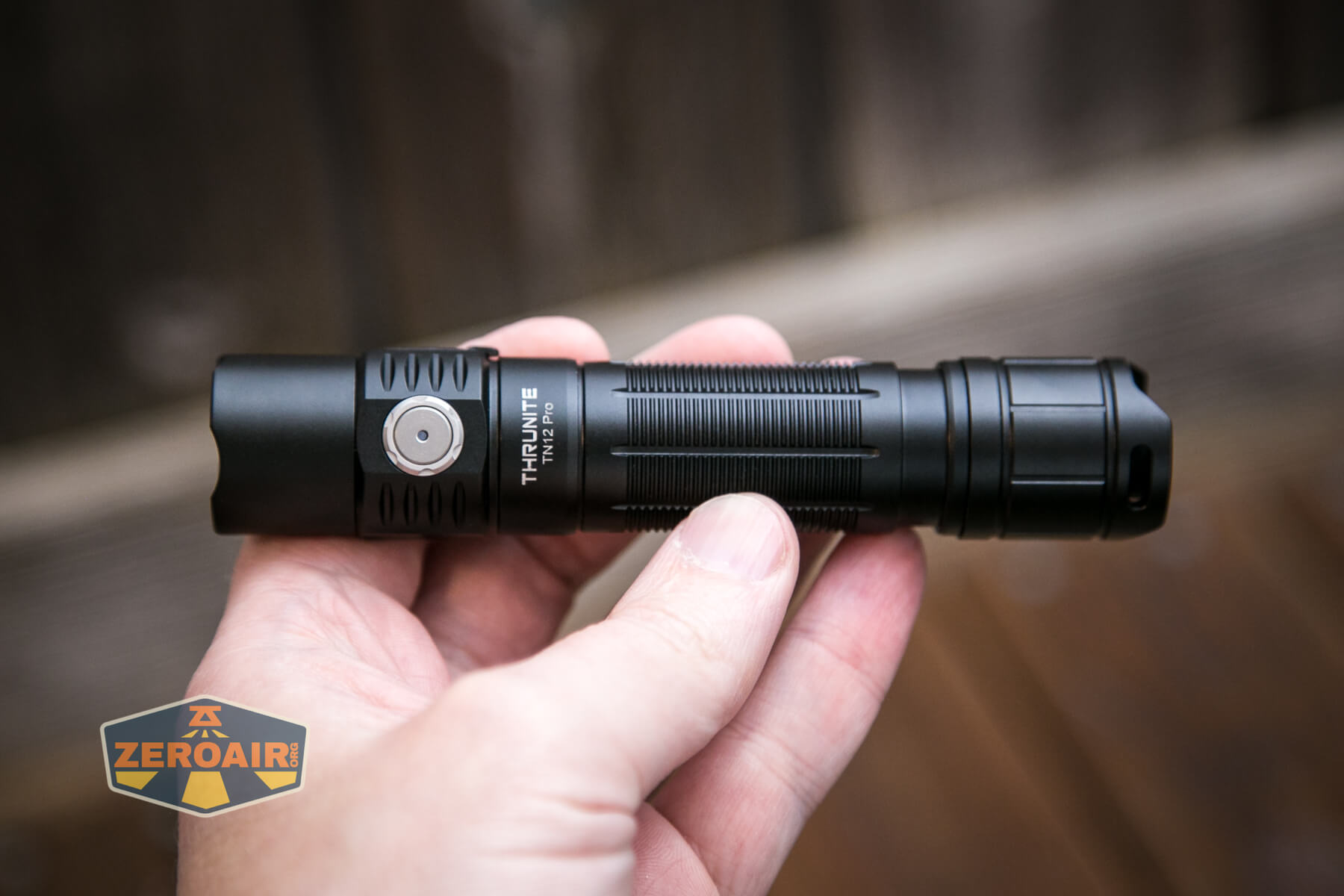 Thrunite TN12 Pro flashlight in hand
