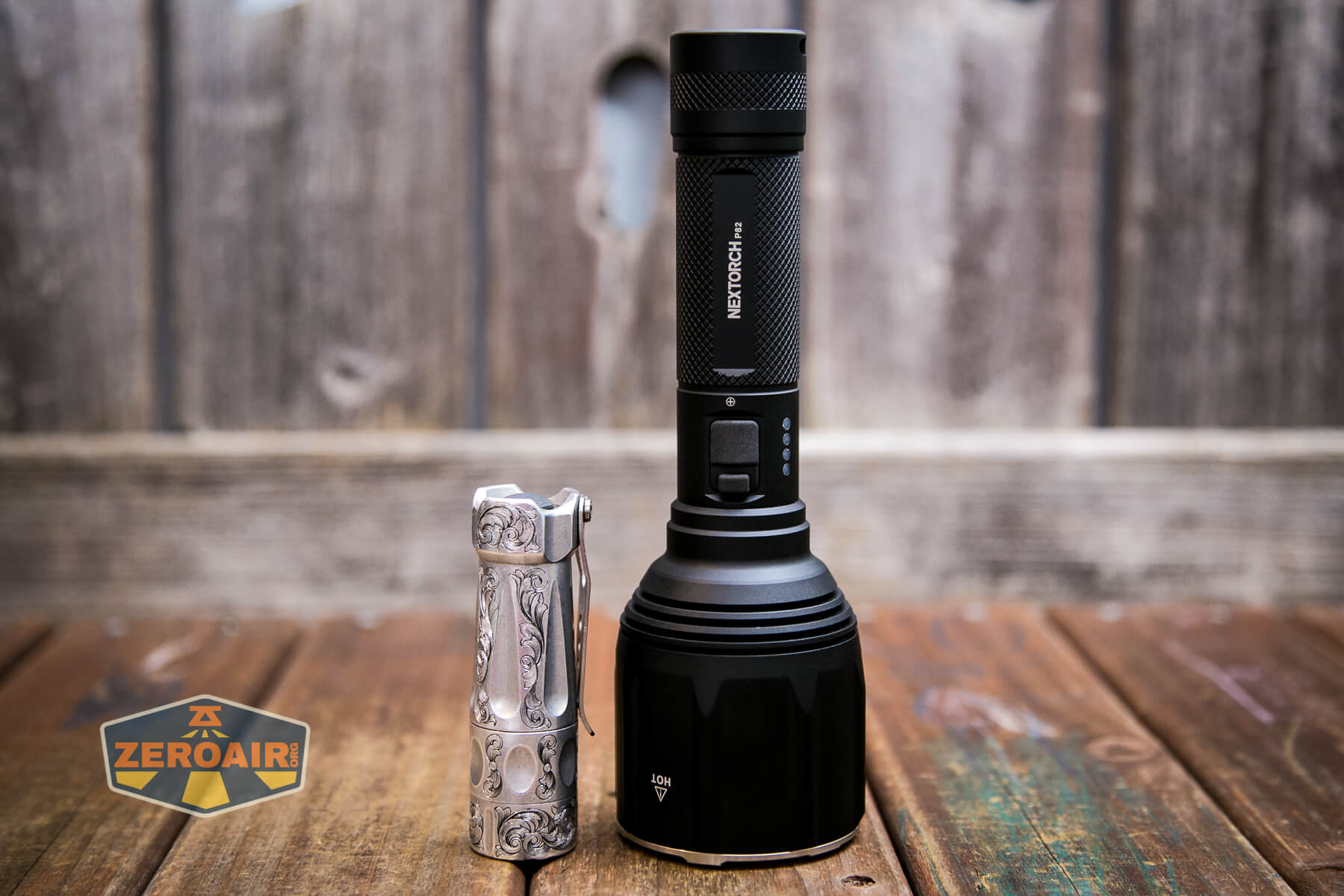 Nextorch P82 long-range flashlight beside the TorchLAB BOSS 35 (custom-engraved)