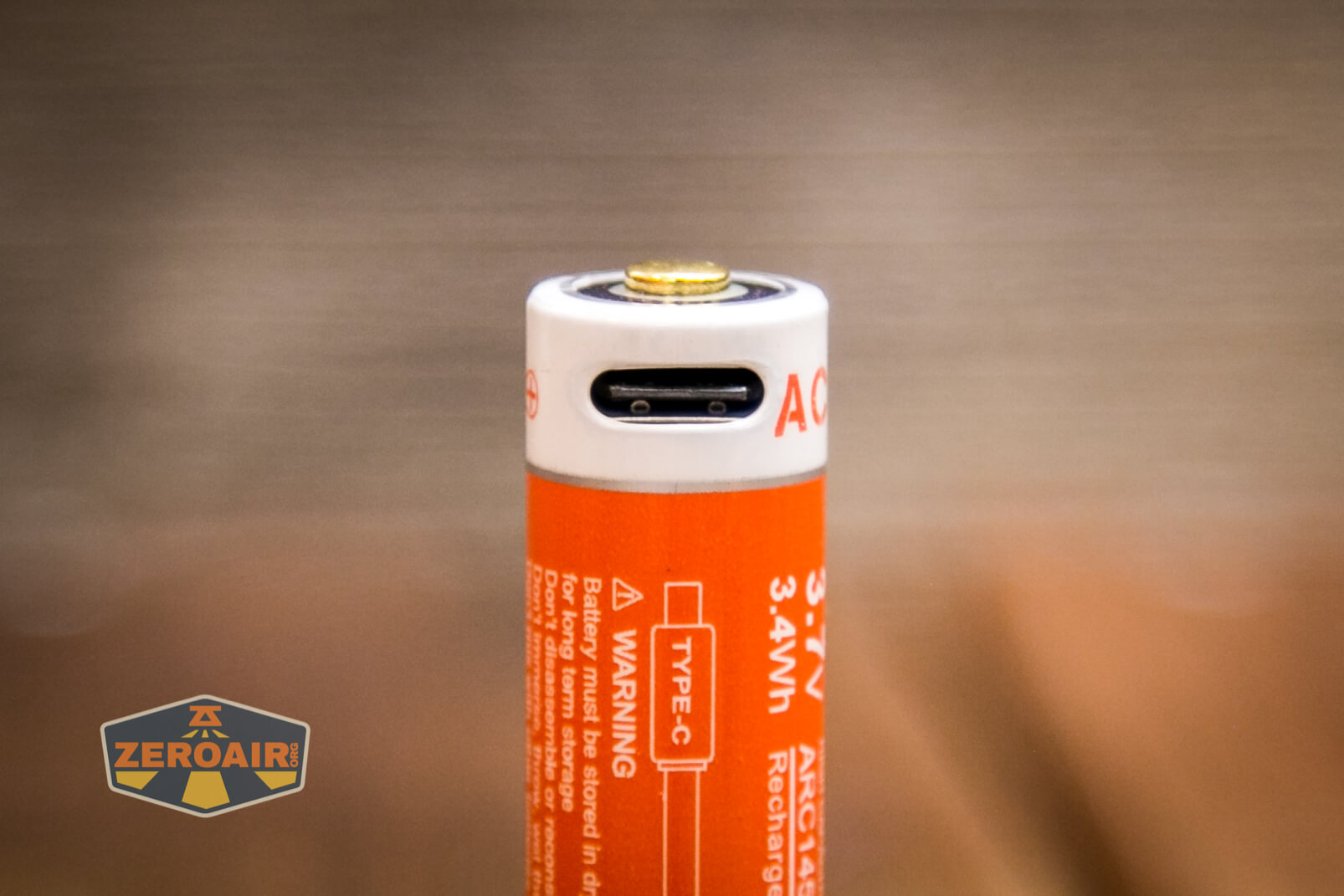 Acebeam Pokelit AA flashlight charging port on cell