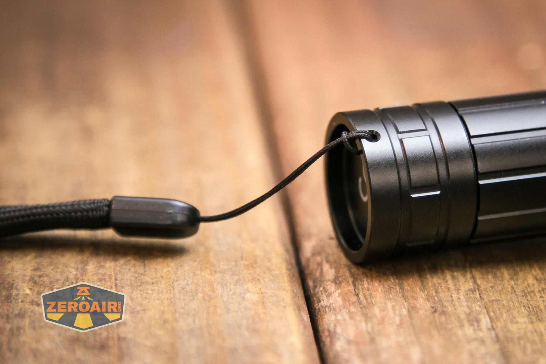 Klarus A2 Pro Zoomable flashlight tailcap lanyard installed