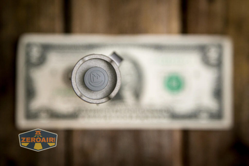 Cyansky P25 V2 flashlight on two dollar bill