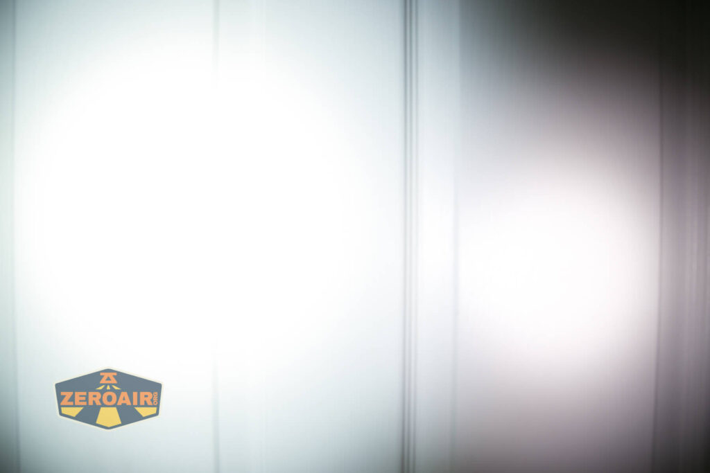 Cyansky P25 V2 flashlight beamshots on door compared to nichia 219b