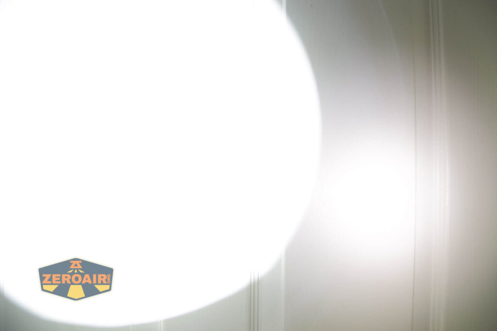 Imalent MR90 flashlight beamshots on door compared to nichia 219b