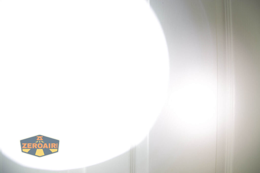 Imalent MR90 flashlight beamshots on door compared to nichia 219b