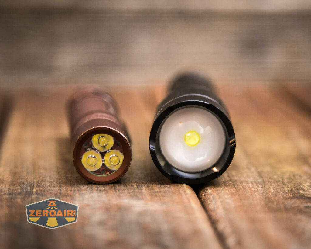 Klarus A2 Pro Zoomable flashlight beside convoy s2+