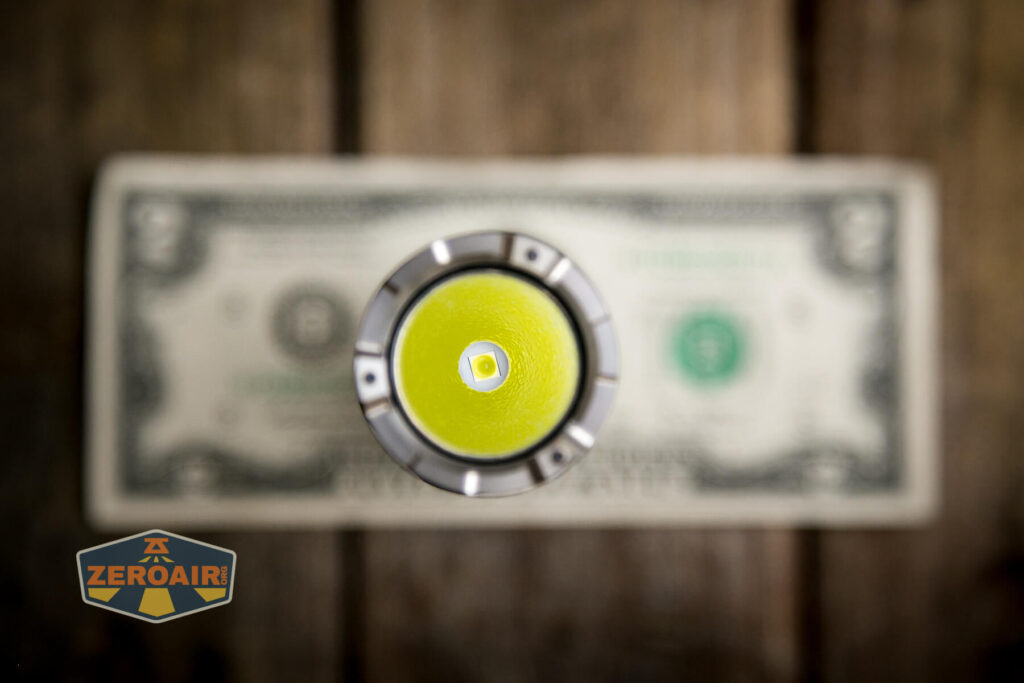 Nextorch P83 flashlight on two dollar bill