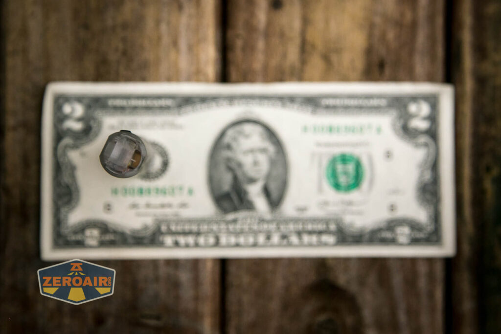 RovyVon A8U keychain flashlight on a two dollar bill